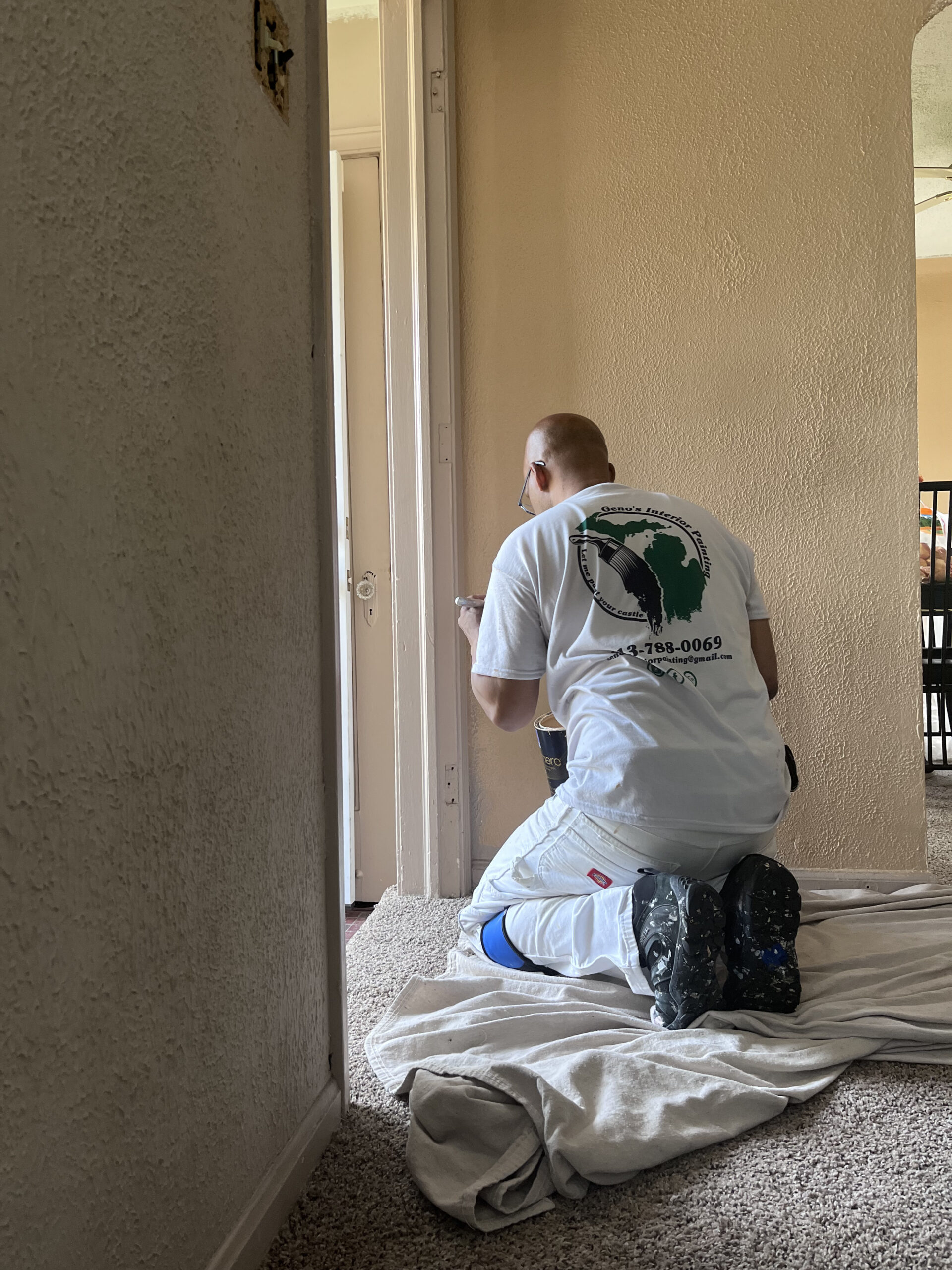 Geno painting on the job